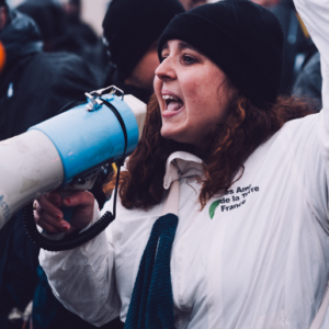 Action Greenpeace France, Les Amis de la Terre France et Alternatiba Paris dans le parc du Chateau de Versailles à l'occasion des 100 ans de Total le 26 mars 2024.
